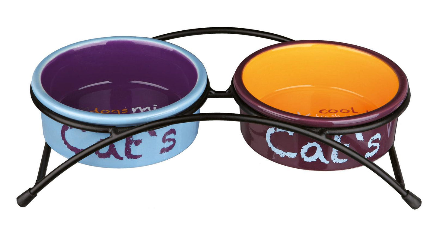 Trixie Eat on Feet ceramic bowl set, 2 x 0.3 l/diam. 12 cm, light blue/orange/purple.